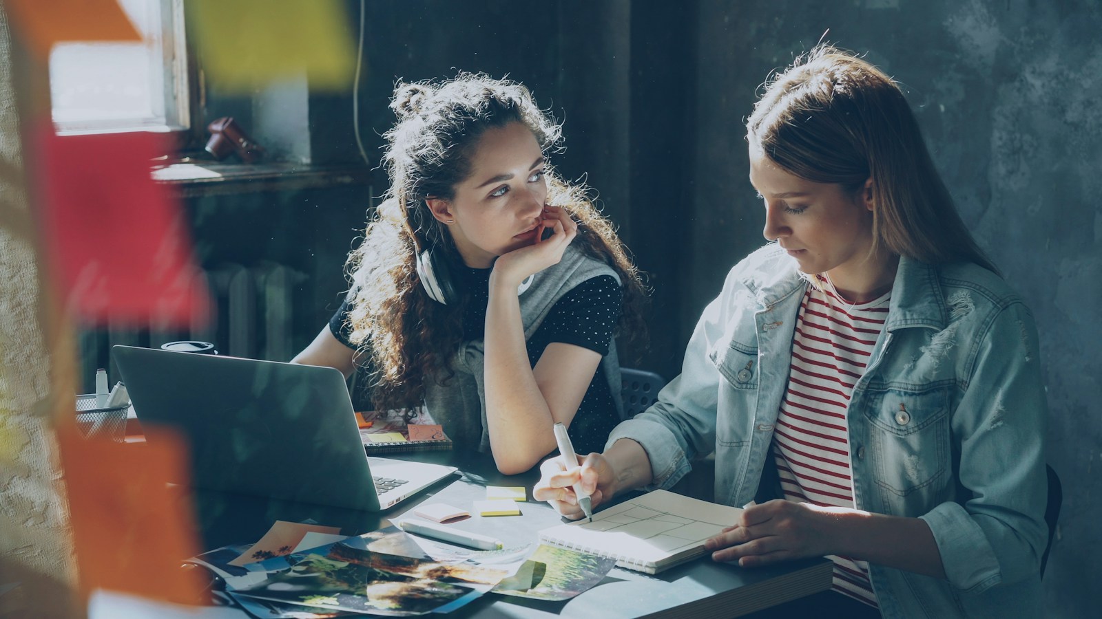 Two women are working together on a project